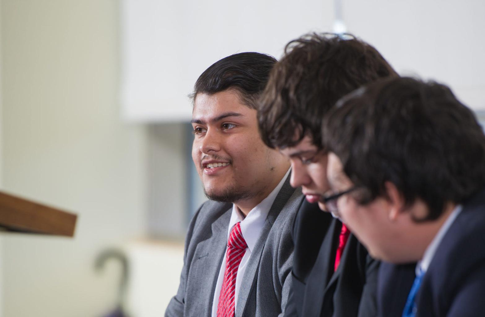 Group of political science students debating.