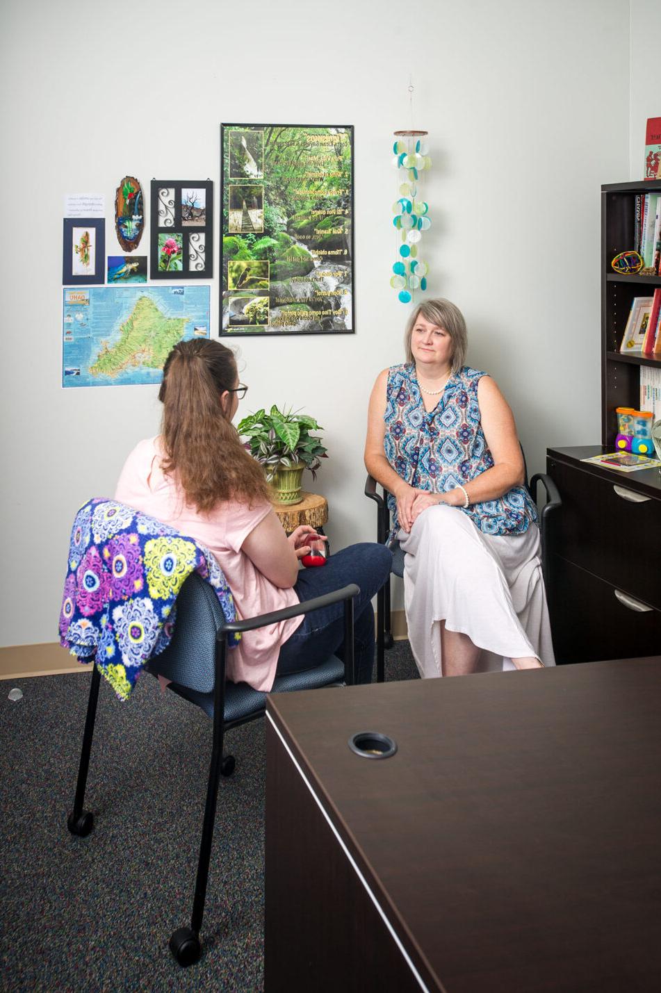 Counselor talking to patient.